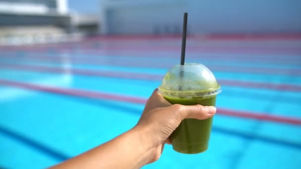 Healthy Living Diet Detox Juice and Swimmer Woman by Sports Swimming Pool — Stock Video