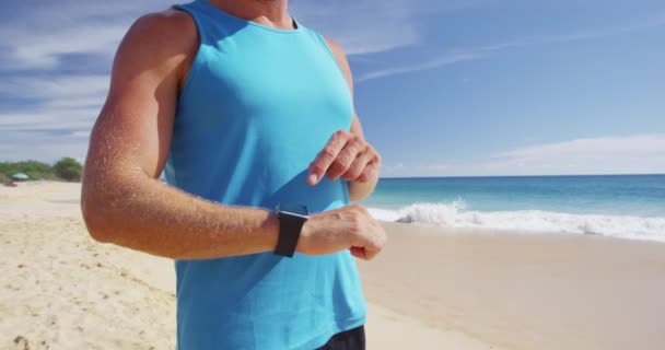 Jaki sport lubisz najbardziej? smartwatch - Athlete runner check on fitness smartwatch exercise — Wideo stockowe