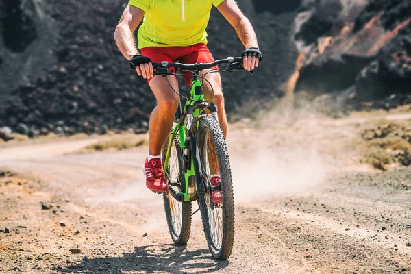 MTB mountain bike biking racer on dirtroad outside at competition. Athlete man racing on cycle dust trail. — Stock Photo, Image