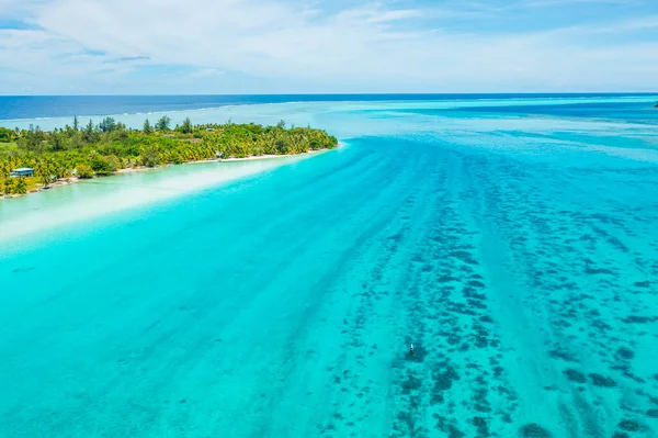 Climate change an Rising sea levels concept photo French Polynesia. Global warming and rising sea levels are a threat to Huahine depicted in image, Tahiti and other island nations. Travel destination.