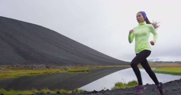 Person running - woman runner on jogging on cross country trail run in nature — Stockvideo