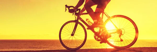 Cyclist biking on road bike sunset banner — Photo