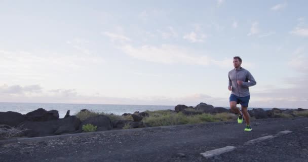 Man runner running on road at in slow motion. — Video