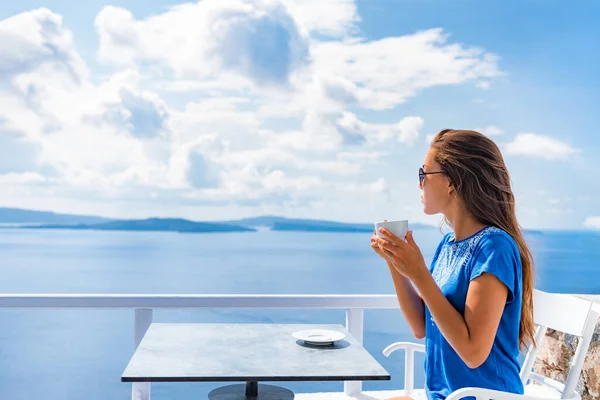 Tranquil morning serene woman relaxing drinking breakfast coffee enjoying ocean sea view on luxury hotel balcony, summer travel holidays. Home living — Stockfoto