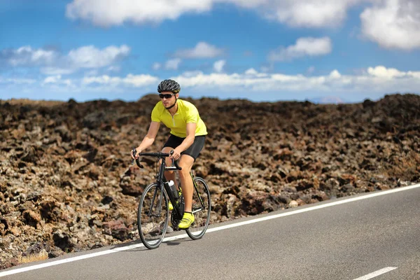 Triathlon biking cyclist man athlete on road bike. Fitness workout outdoors in nature landscape. Male sports competition. — Stock Photo, Image