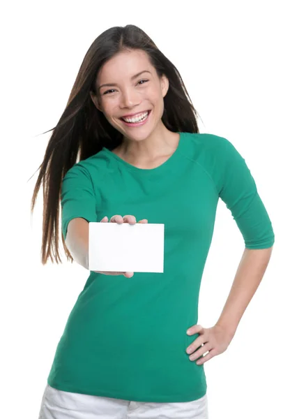 Happy young casual Asian woman holding blank sign showing business card for text advertisement — Stok fotoğraf