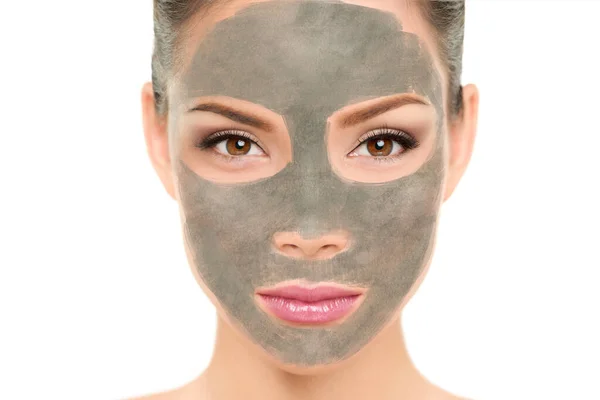 Clay mask facial treatment Asian beauty woman. Wellness and spa purifying peel off mask face portrait, isolated on white background. Cleansing skin care to remove blackheads and clean pores — Stock Photo, Image