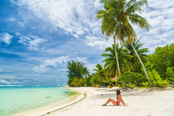 Relaxing woman sunbathing lying in sand on beach in bikini on Bora Bora Tahiti — Stock Photo, Image