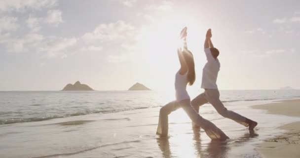 Yoga meditation and wellness lifestyle concept on beach at sunrise — Stock Video