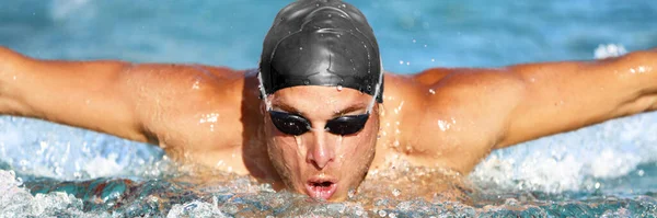 Man swimmer swimming butterfly strokes in pool — Stock Photo, Image