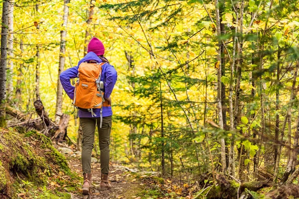 Autumn hike backpacker lifestyle woman walking — Stock Photo, Image