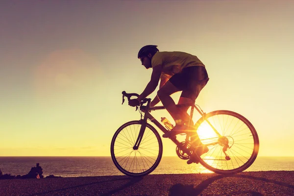 Cyclist riding road bike biking silhouette — Stock Photo, Image