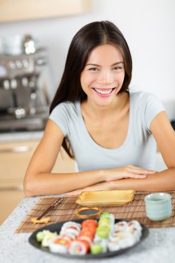Woman sitting with sushi clipart