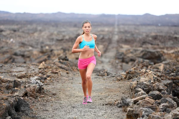 Woman running on volcano — Stock Photo, Image