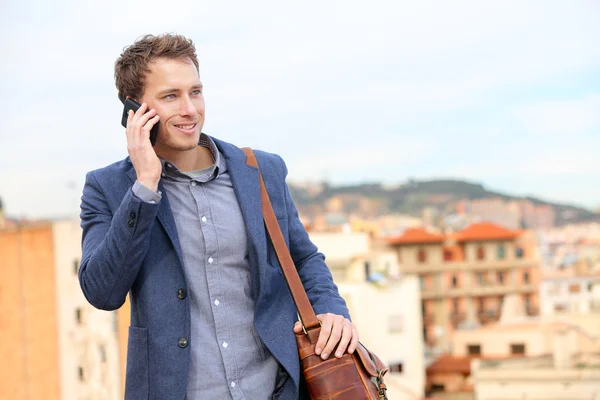 Businessman talking on smart phone — Stock Photo, Image