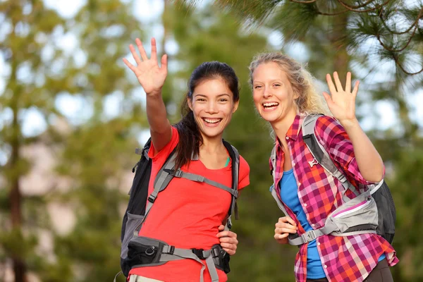 Hiking women waving hello — Stock Photo, Image