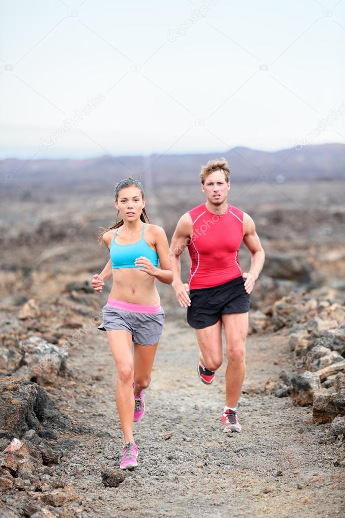 Couple running on trail in country — Stock Photo © Maridav #52885681