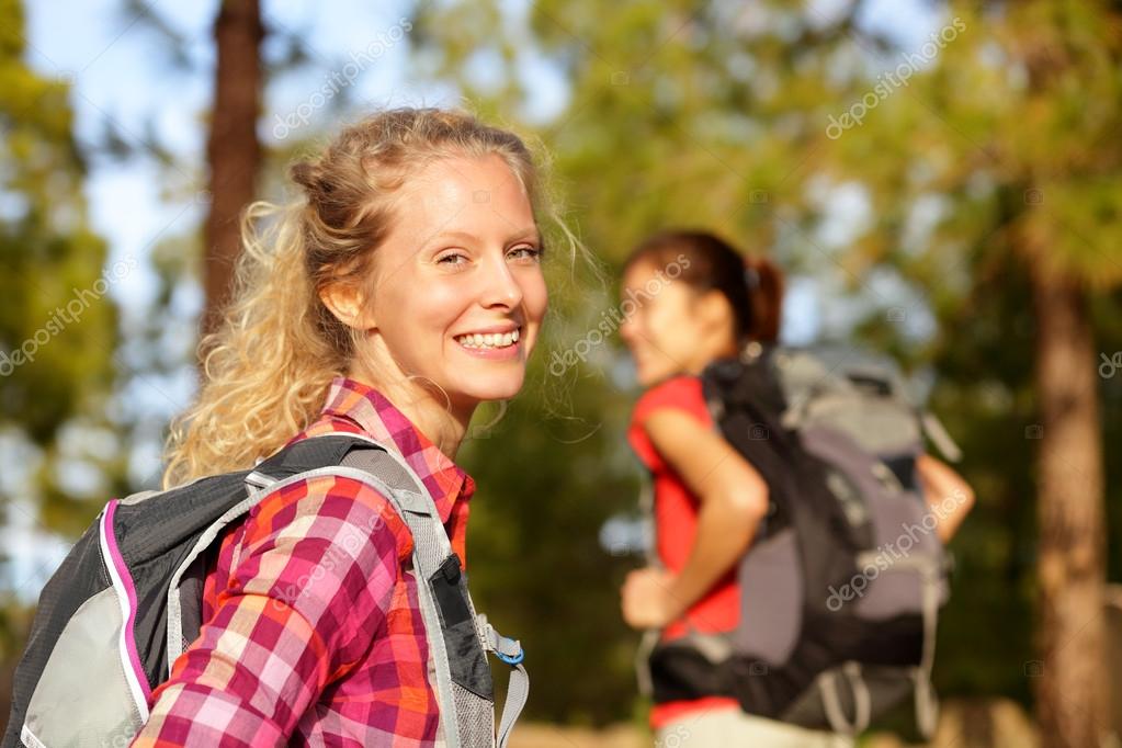 Woman hiking in forest Stock Photo by ©Maridav 52887437