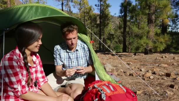 Couple in tent taking selfie — Stock Video