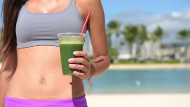 Slender Woman Holding Green Juice — Stock Video