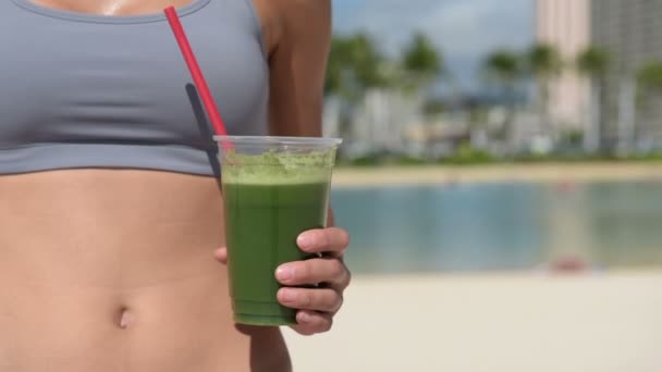 Woman drinking green juice — Stock Video