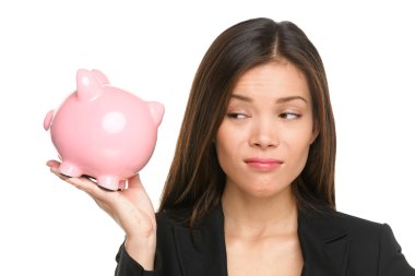 Woman looking displeased at piggy bank clipart