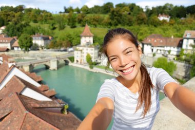 Woman taking selfie in Bern clipart