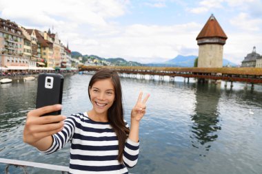 Tourist selfie woman in Lucerne clipart