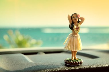 Hula dancer doll on Hawaii car road trip clipart