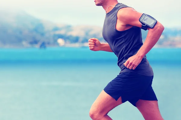 Runner in esecuzione musica d'ascolto — Foto Stock