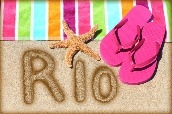 Word RIO written on golden sand — Stock Photo, Image