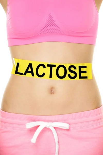 Partie inférieure du corps féminine avec mot Lactose — Photo