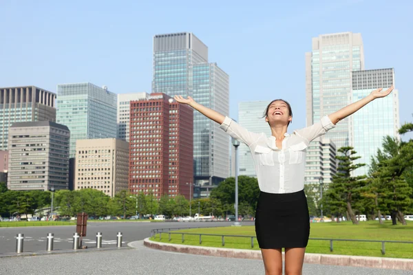 Businesswoman cheering open arms in Tokyo — Stock Photo, Image