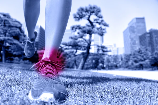 Runner feet with ankle pain. — Stock Photo, Image