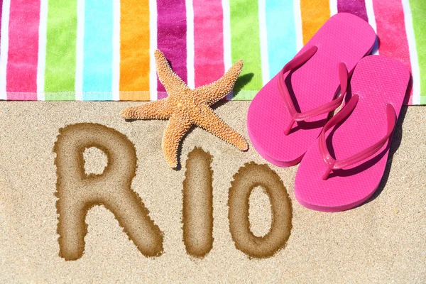 Word RIO written on golden sand — Stock Photo, Image