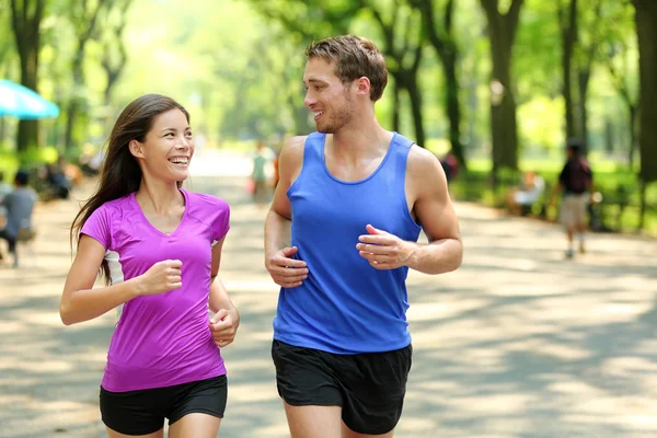 Couple training in Central Park Stock Picture