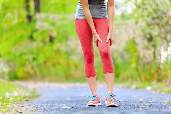 Sports muscle injury of female runner thigh — Stock Image Sports muscle injury of female runner thigh Stock Image