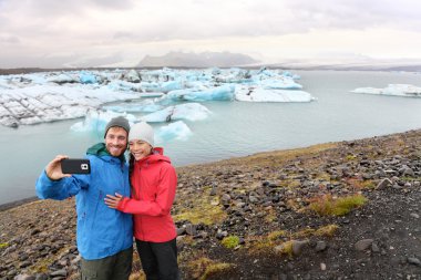 couple taking selfie on Iceland clipart