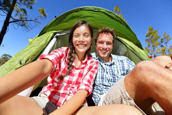 Camping people in tent taking self portrait — Stock Photo, Image