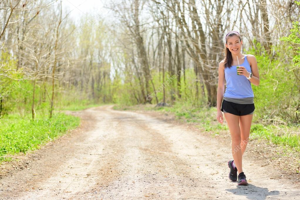 Woman runner drinking smoothie — Stock Photo © Maridav 73837647