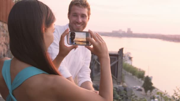 Woman taking picture of boyfriend — Stock Video