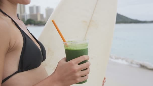 Woman drinking smoothie after surfing — Stock Video