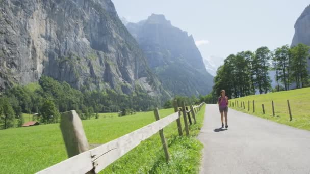 Woman hiking in Switzerland alps — Stock Video