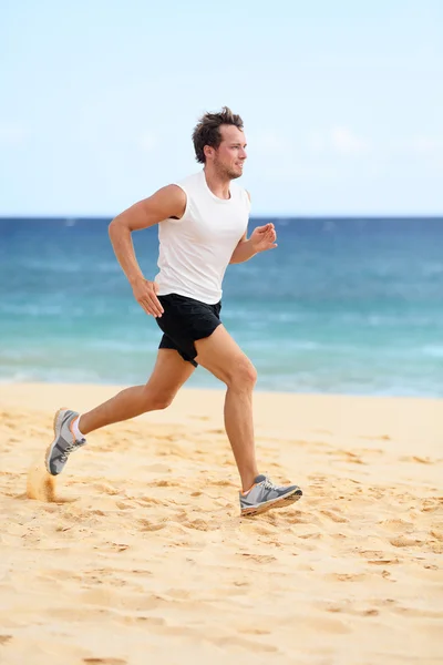 Runner man running on beach — Stok fotoğraf