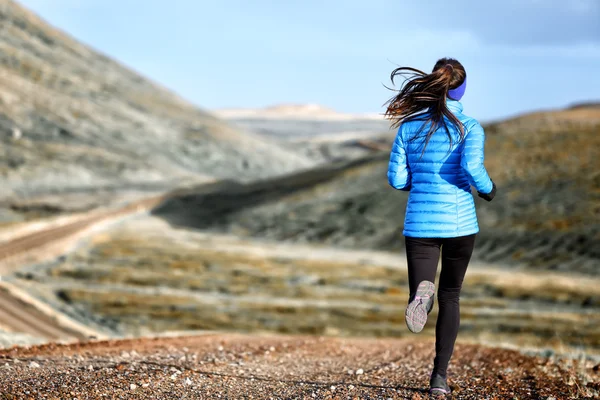 Woman running in down jacket