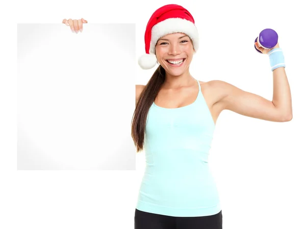 Christmas Fitness kvinna visar billboard — Stockfoto