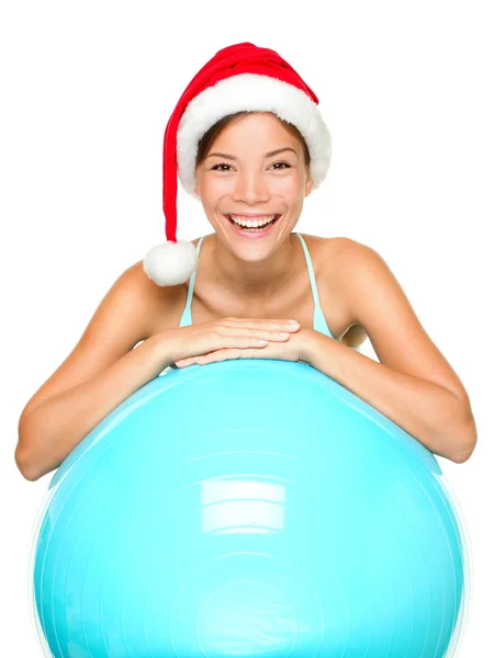 Christmas fitness woman on exercise ball — Stock Photo, Image