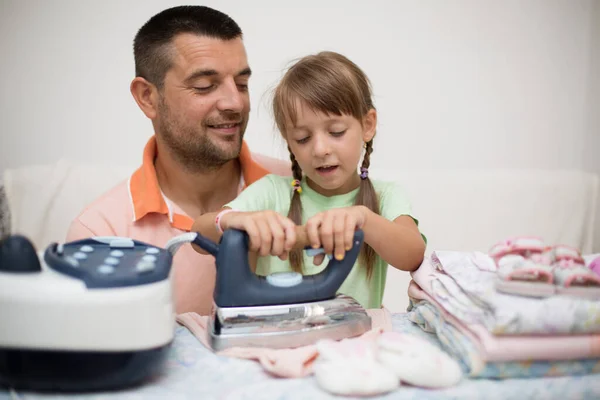 Father Little Daughter Ironing Kids Clothes Home Domestic Concept — стоковое фото