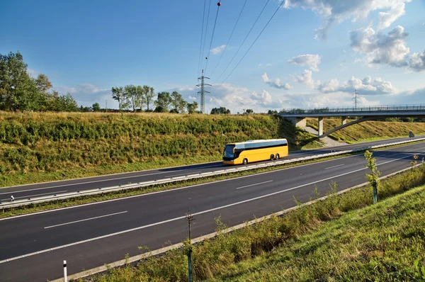 Corridor highway with yellow bus — Stock Photo, Image