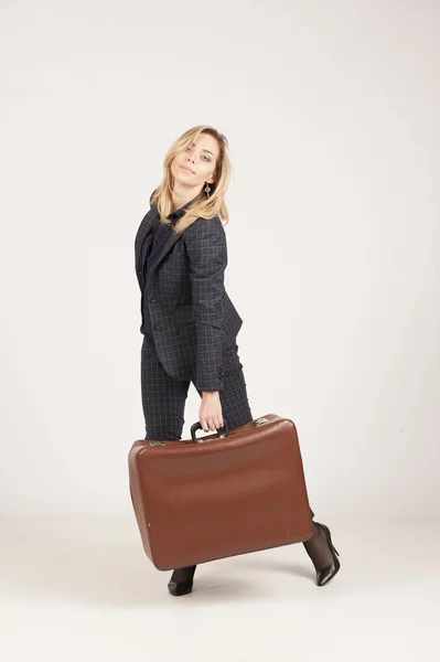 Woman carrying a suitcase — Stock Photo, Image